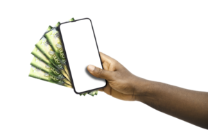 Black hand holding mobile phone with blank screen and Kenyan shilling notes png
