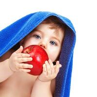 Pretty toddler eating apple photo