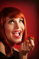 Woman eat strawberry photo