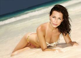 Sensual woman on the beach photo