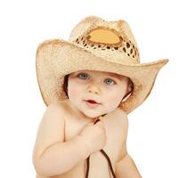 Little boy wearing cowboy hat photo