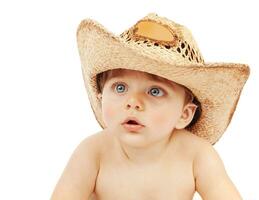Cute child wearing cowboy hat photo