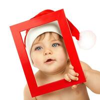 Baby boy wearing Santa Claus hat photo