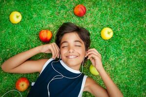Cheerful boy listening to music photo