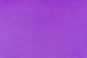 Texture of purple fabric diagonal weave pattern. Decorative textile background photo