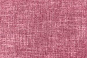 Texture of pink upholstery fabric. Decorative textile background photo