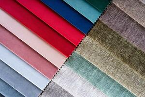 Multi colored set of upholstery fabric samples for selection, collection of textile swatches photo