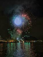 colorful fireworks in the night sky on the seafront of Alicante spain photo