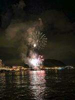 colorful fireworks in the night sky on the seafront of Alicante spain photo