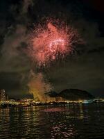 colorful fireworks in the night sky on the seafront of Alicante spain photo