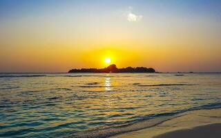 Kuramathi Maldives tropical paradise island sunset view from Rasdhoo. photo