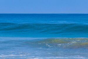 Extremely huge big surfer waves at beach Puerto Escondido Mexico. photo