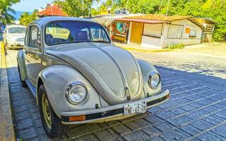 Puerto Escondido Oaxaca Mexico 2023 Colorful tuned old classic vintage car cars Puerto Escondido Mexico. photo