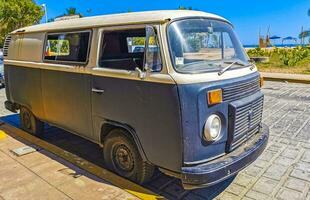 Puerto Escondido Oaxaca Mexico 2023 Old vintage classic minibuses vans transporters vehicles cars in Mexico. photo