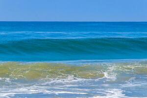 Extremely huge big surfer waves at beach Puerto Escondido Mexico. photo