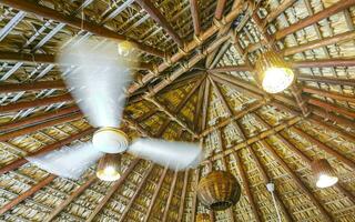 White fan under palapa roof in Puerto Escondido Mexico. photo