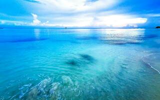 Tropical Caribbean beach clear turquoise water Playa del Carmen Mexico. photo