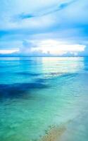 Tropical Caribbean beach clear turquoise water Playa del Carmen Mexico. photo