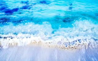 Waves at tropical beach caribbean sea clear turquoise water Mexico. photo