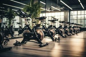 interior de un aptitud salón con filas de ejercicio bicicletas en el gimnasia, filas de estacionario bicicletas y salud ejercicio equipo para culturismo en gimnasio moderno aptitud centrar habitación, ai generado foto