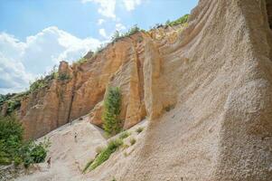 the rock formations in the canyon are very tall photo