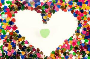 a heart shaped frame made of colored hearts photo