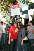 Mila Kunis  Friend Screen Actors Guild Support the Writers Guild of America Strike Outside NBCUniversal Studios Lot Lankershim Blvd Los Angeles CA November 13 2007 2007 photo