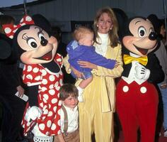 Deidre Hall Mickey and Minnie Mouse with Deidres sons David and Tully Sohmer The Aristocats permiere Los Angeles CA April 18 1996 2005 photo