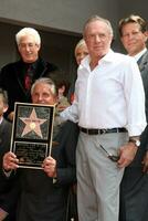 George Hamilton  James Caan at the Hollywood Walk of Fame ceremony bestowing a Star in his honor  in Hollywood CA  on August 12  2009 photo