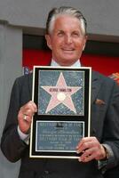 George Hamilton at the Hollywood Walk of Fame ceremony bestowing a Star in his honor  in Hollywood CA  on August 12  2009 photo