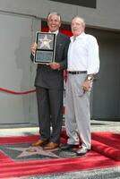 George Hamilton  James Caan at the Hollywood Walk of Fame ceremony bestowing a Star in his honor  in Hollywood CA  on August 12  2009 photo