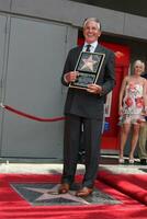 George Hamilton at the Hollywood Walk of Fame ceremony bestowing a Star in his honor  in Hollywood CA  on August 12  2009 photo