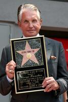 George Hamilton at the Hollywood Walk of Fame ceremony bestowing a Star in his honor  in Hollywood CA  on August 12  2009 photo