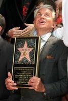 George Hamilton at the Hollywood Walk of Fame ceremony bestowing a Star in his honor  in Hollywood CA  on August 12  2009 photo