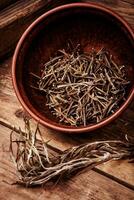 Dried rosemary on vintage background photo