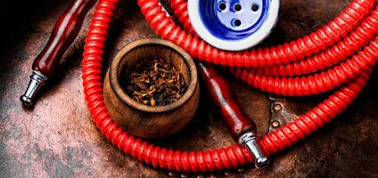 Smoking shisha with tobacco photo