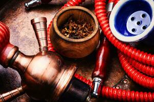 Smoking shisha with tobacco photo