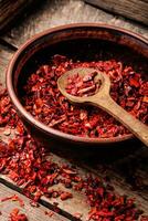 Heap of red pepper flakes photo