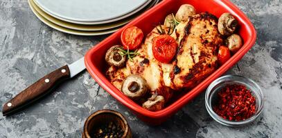 Delicious chicken in baking dish photo