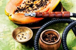 Smoking hookah with tobacco papaya photo