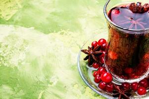 Hot tea with cranberry photo