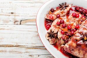 Chicken breasts with cranberry sauce photo