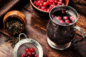 Hot tea with cranberry photo