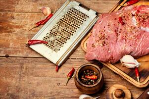 Raw fresh meat on wooden background photo