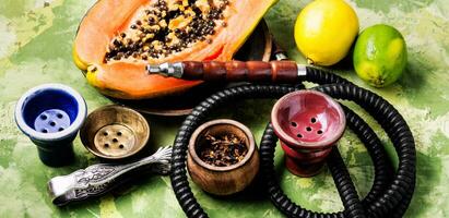Smoking hookah with tobacco papaya photo