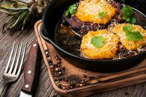 Juicy steak slices in pan photo