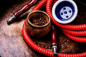 Smoking hookah with tobacco photo