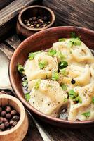 Ukrainian pelmeni on plate photo