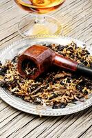Tobacco pipe and alcohol photo