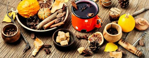 Mulled wine in autumn foliage photo